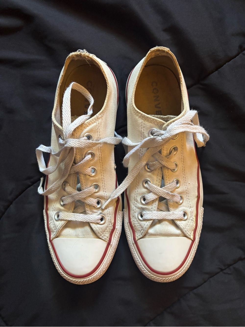 low-top white converse sneakers